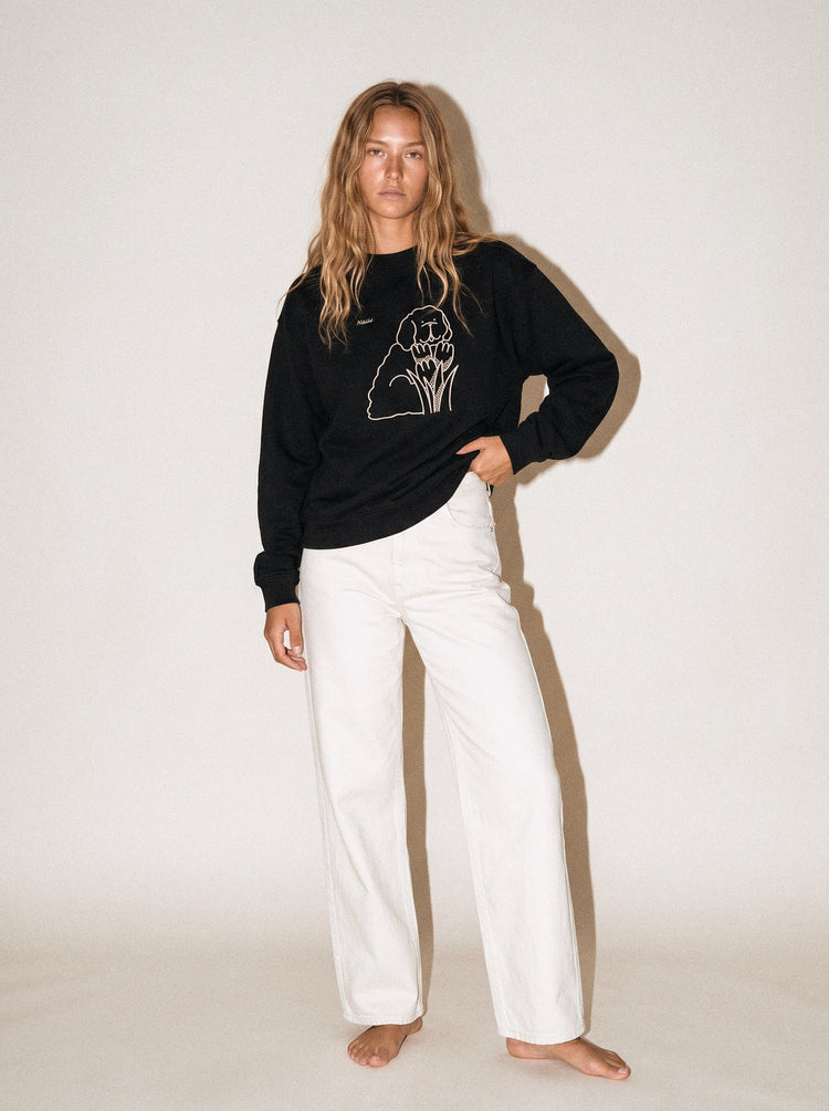 artist collection bloom tulip dog design black crewneck sweatshirt female model editorial