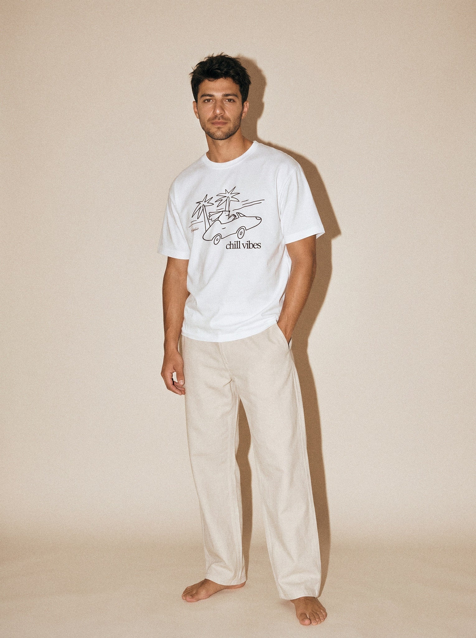 artist collection chill vibes palms dog design pure white t shirt male model editorial full body