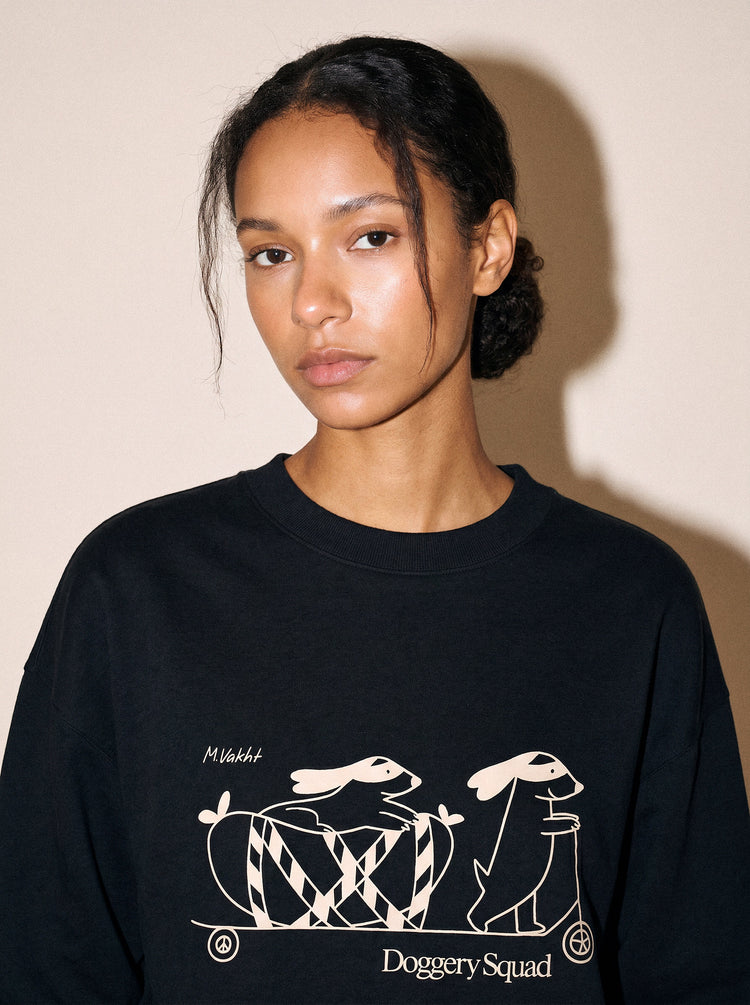 artist collection doggery squad skateboard dogs design black crewneck sweatshirt female model editorial