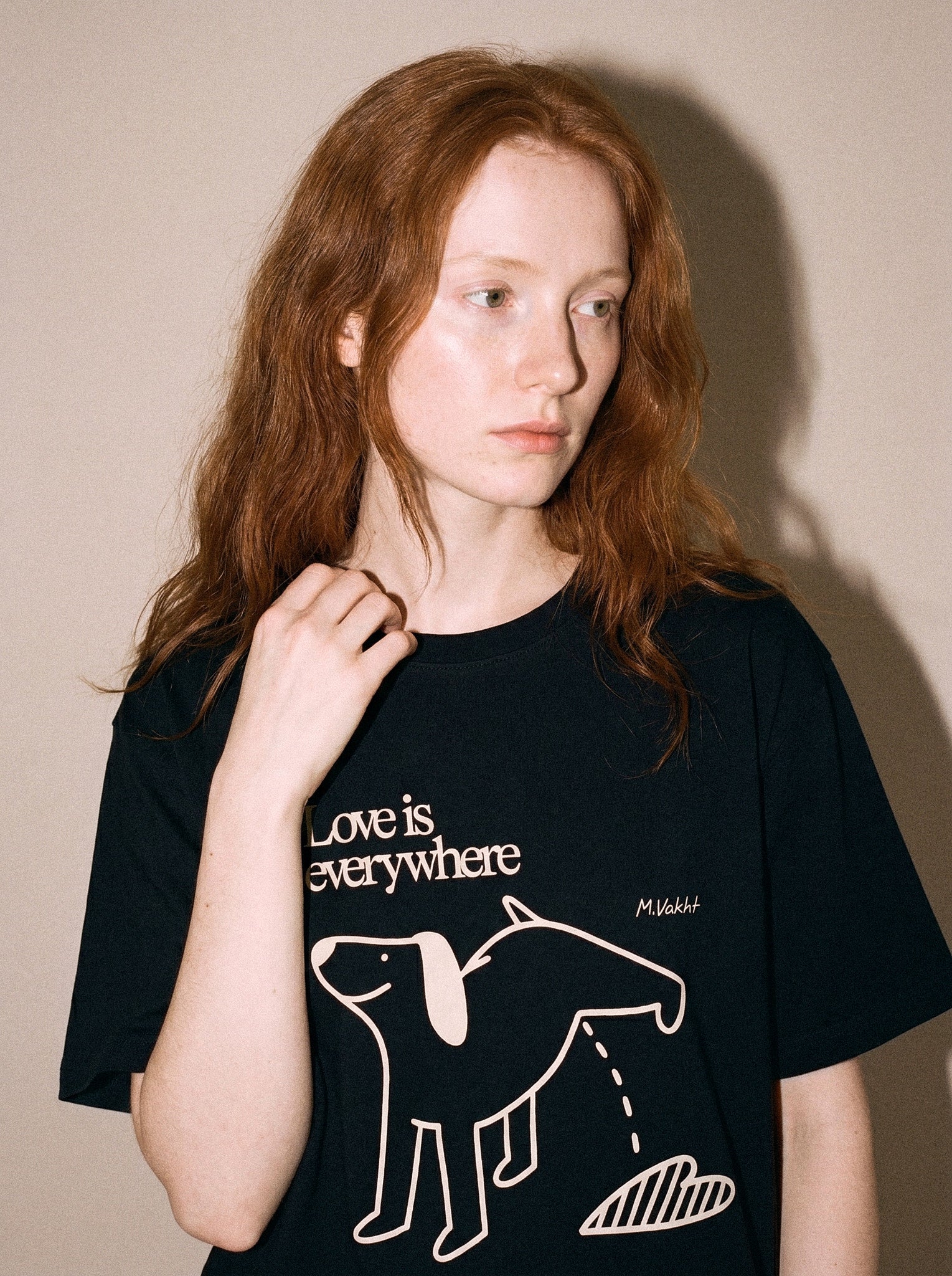 artist collection love is everywhere dog heart design black t shirt female model editorial portrait