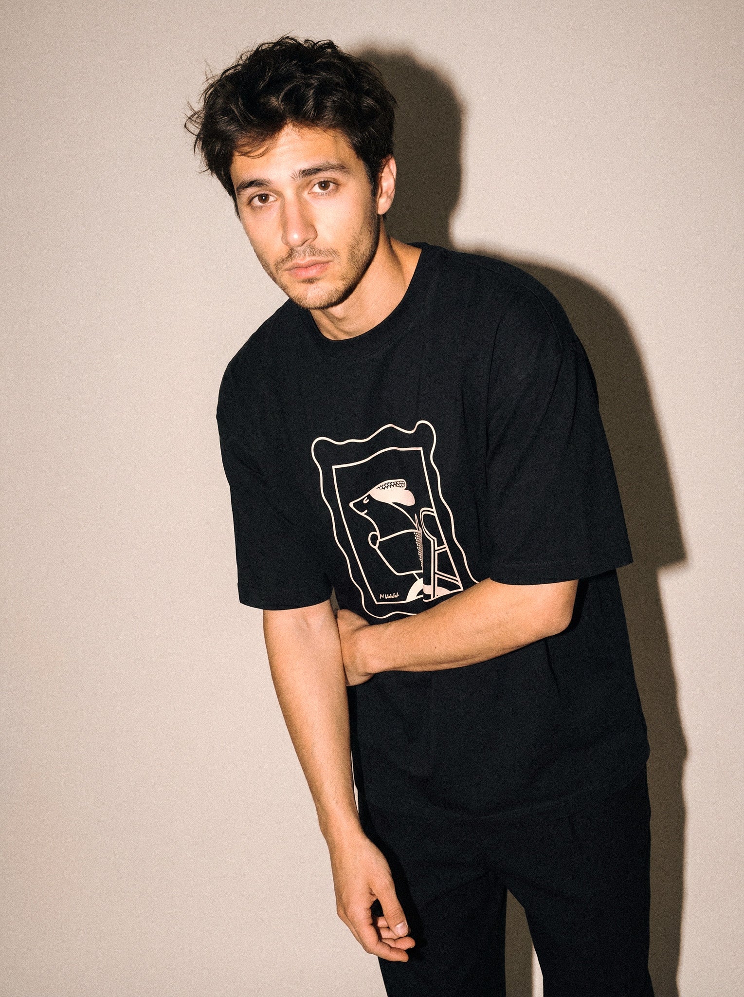 artist collection sunday ride basket dog design black t shirt male model editorial mid figure