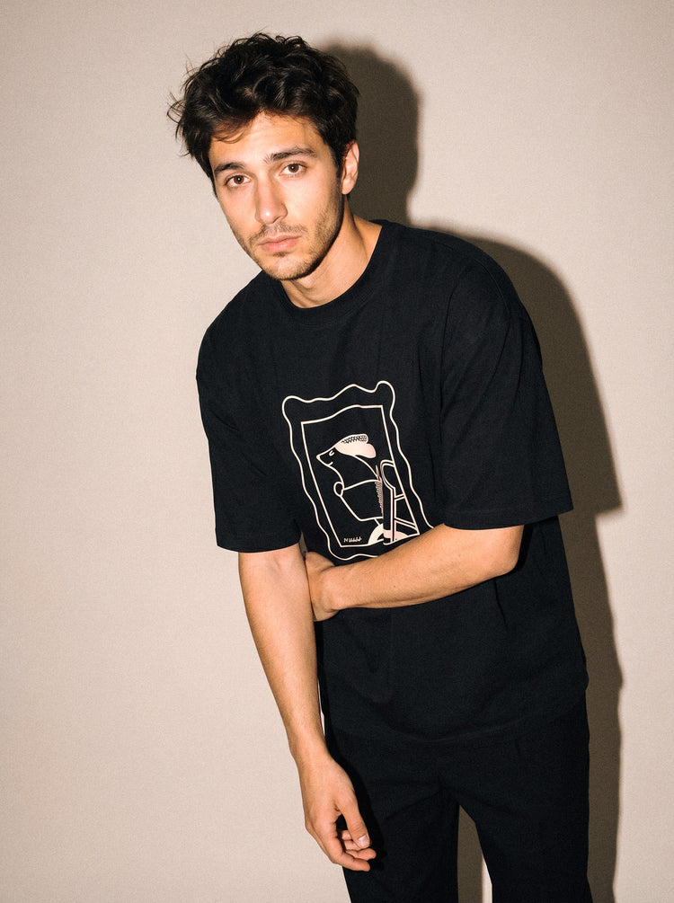artist collection sunday ride basket dog design black t shirt male model editorial mid figure