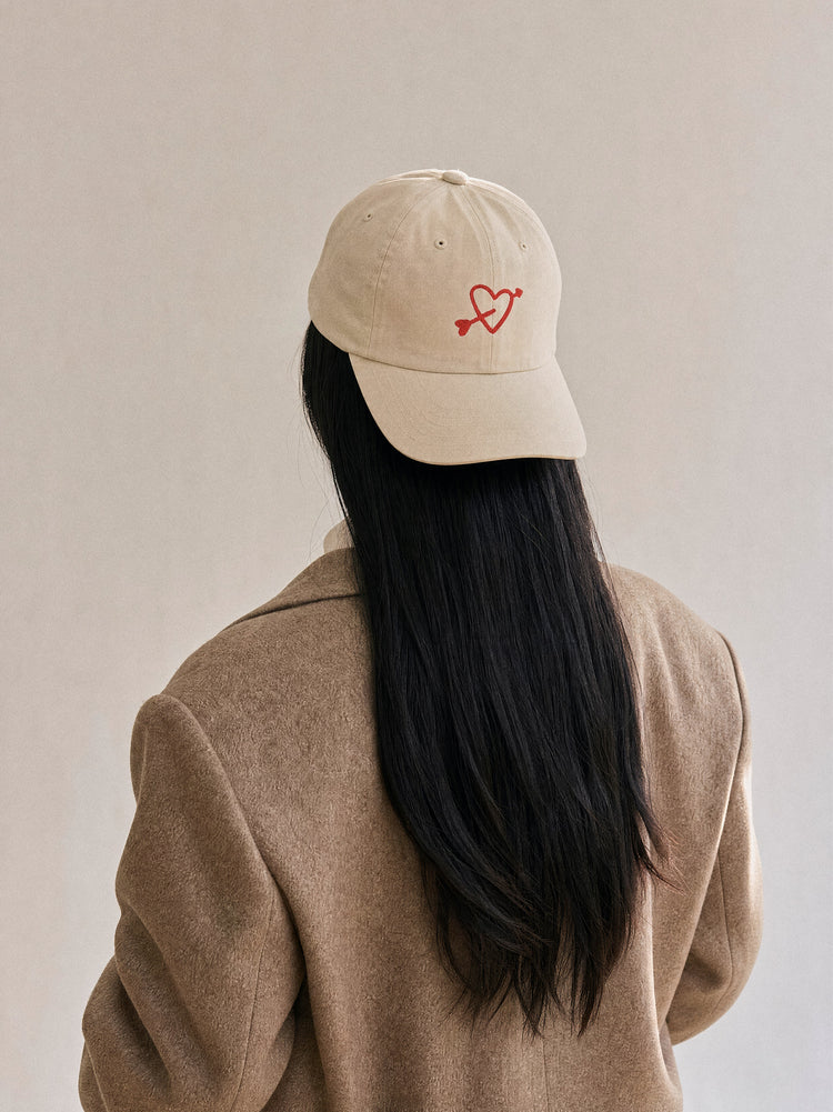 cap charity heart arrow oyster front view asian woman