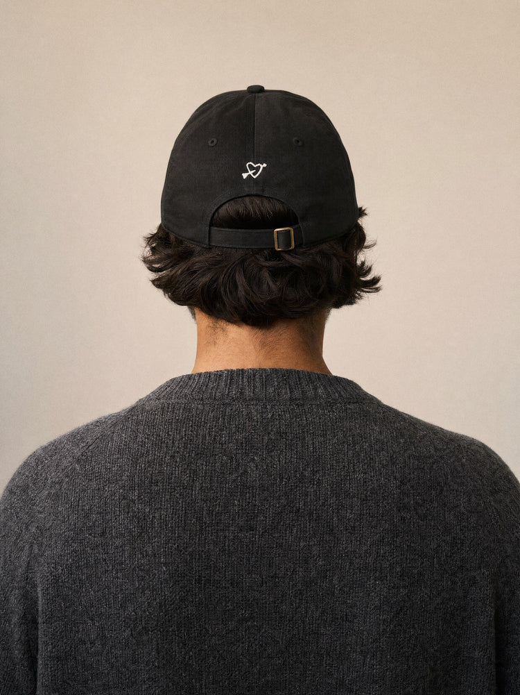 cap more dog is more dog black back view mediterranean man