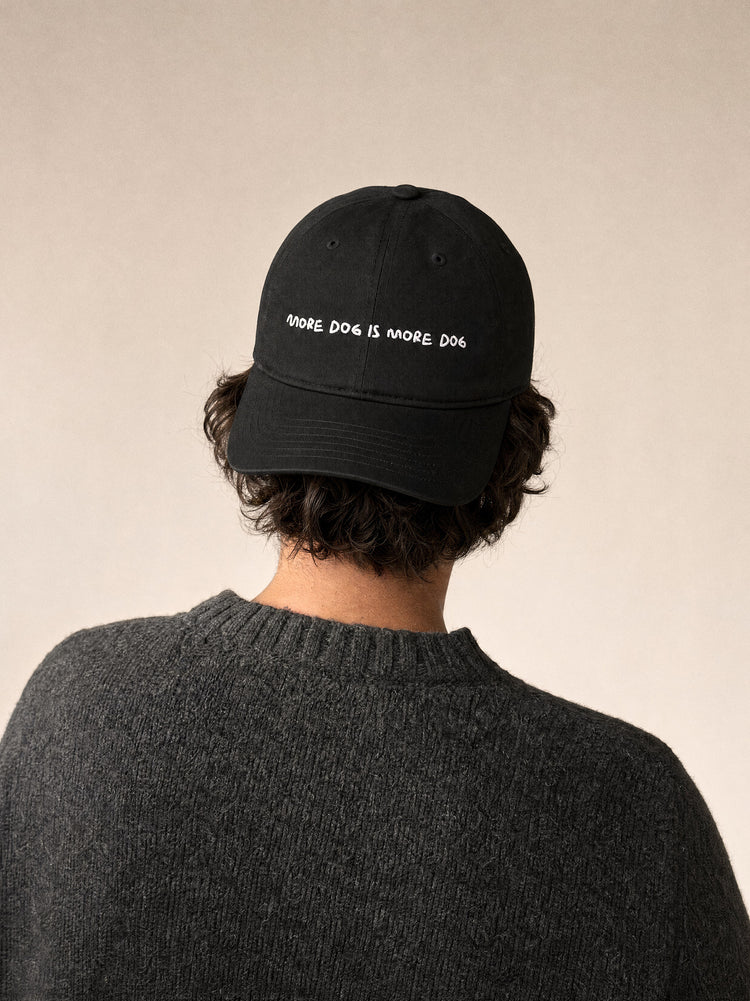 cap more dog is more dog black front view mediterranean man