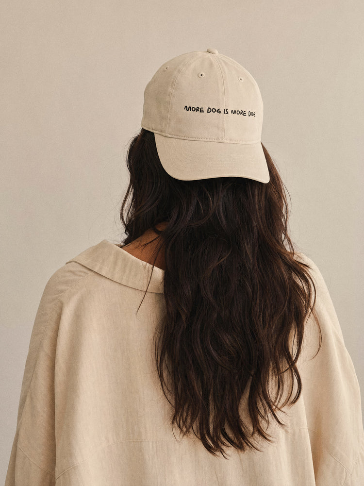 cap more dog is more dog oyster front view latina woman