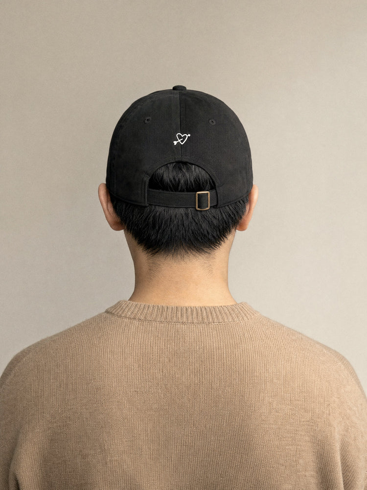 cap powered by dogs black back view east asian man