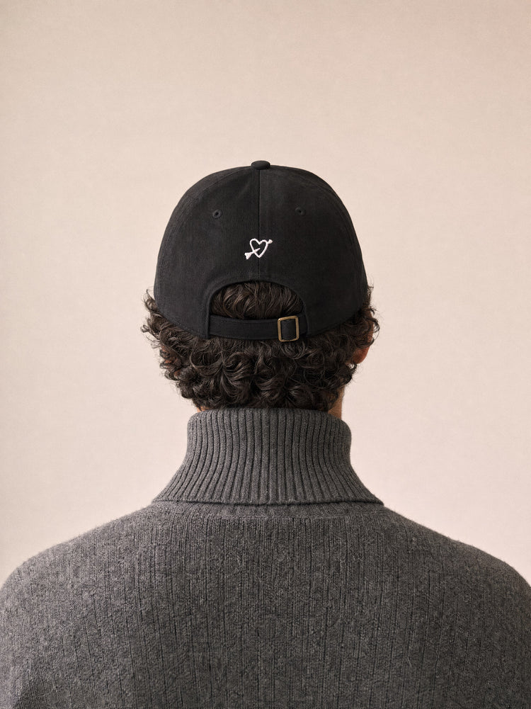 cap you can pet the dog black back view middle eastern man