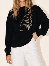 artist collection bloom tulip dog design black crewneck sweatshirt female model editorial