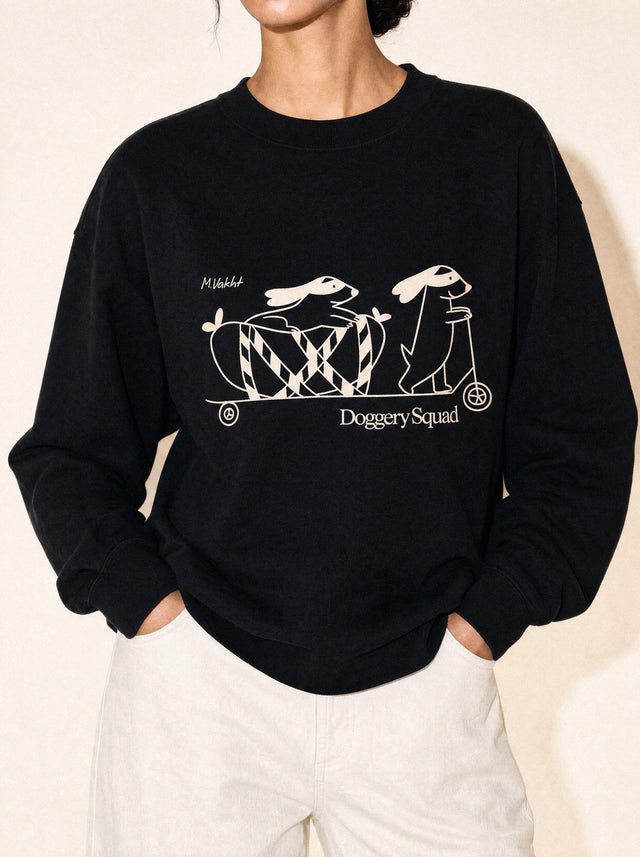 artist collection doggery squad skateboard dogs design black crewneck sweatshirt female model editorial