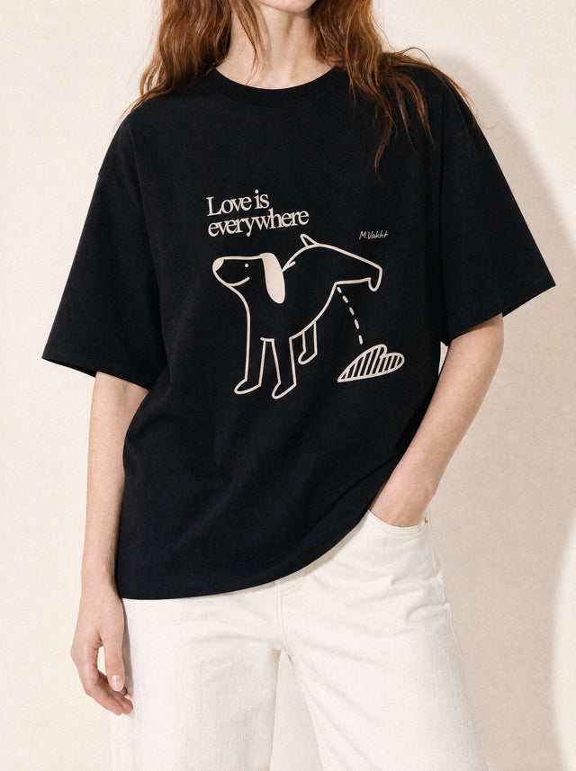 artist collection love is everywhere dog heart design black t shirt female model editorial portrait